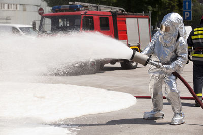 Firefighter spraying water