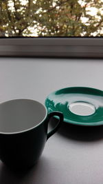 Close-up of coffee cup on table