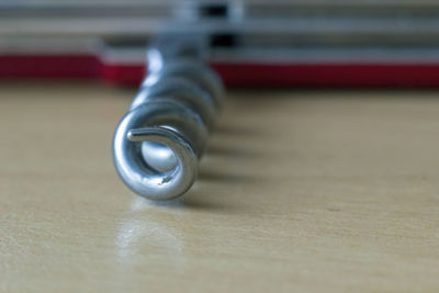 Close-up of metal on table