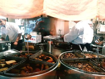 People working at market stall