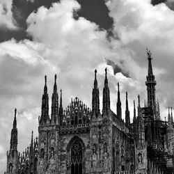 Panoramic view of church and buildings against sky