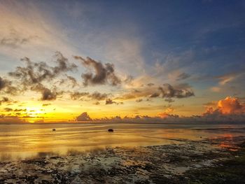 Scenic view of sea against romantic sky at sunset