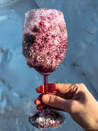 Snow-covered glass stained with red wine