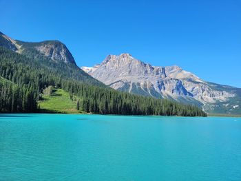 Scenic view of mountains against clear blue sky