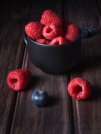 High angle view of strawberries in bowl on table