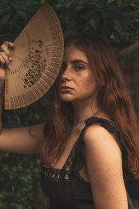 Portrait of young woman looking away