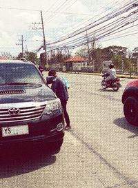 Man on motorcycle against sky