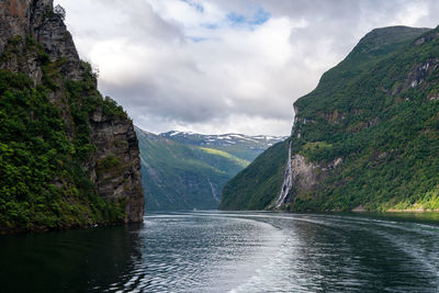 Scenic view of lake amidst mountains against sky