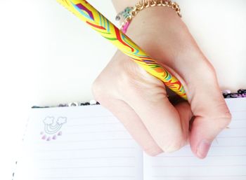 Close-up of woman hand holding paper