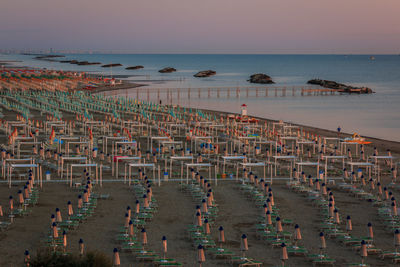 High angle view of beach against sky during sunset