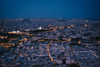 High angle view of buildings in city at night