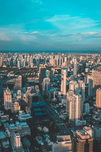 High angle view of modern buildings in city against sky