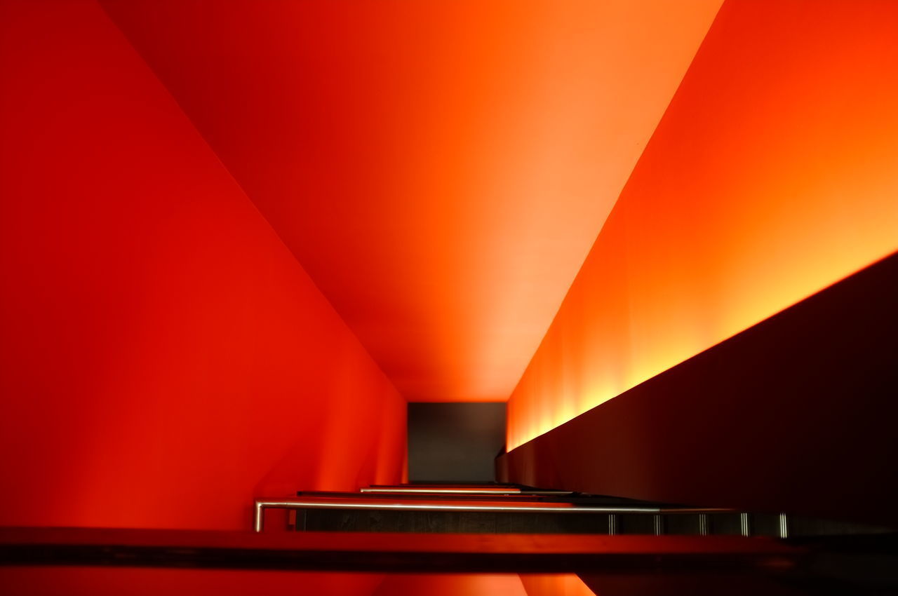 INTERIOR OF ILLUMINATED ORANGE SUBWAY