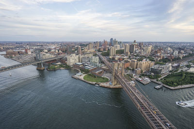 Aerial view of suspension bridges over east river at manhattan