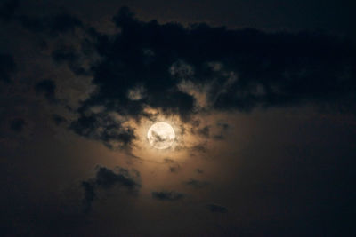 Low angle view of moon at sunset