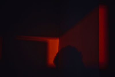 Shadow of people on wall in darkroom