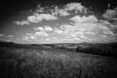 Scenic view of landscape against cloudy sky