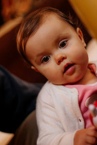 Close-up portrait of cute baby at home