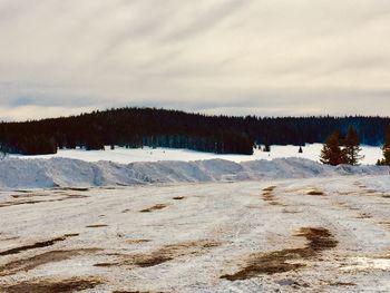 Scenic view of snowcapped landscape against sky