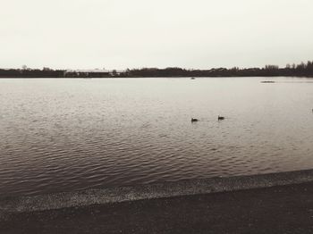 Scenic view of lake against clear sky