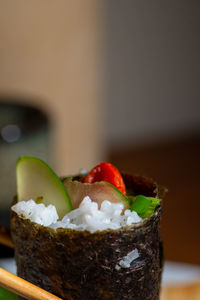 Close-up of sushi served on table