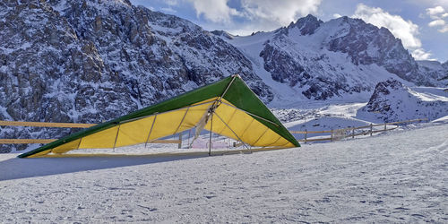 Scenic view of snow covered mountains against sky