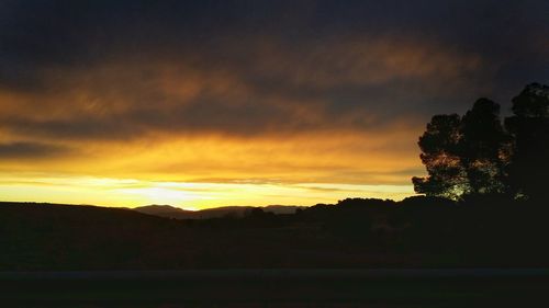 Scenic view of silhouette landscape against sky during sunset