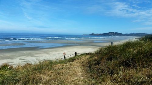 View of beach against blue sky