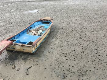 Boat moored on beach