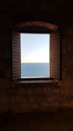 Sea seen through window of building