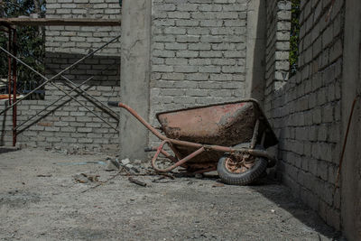 Old rusty bicycle against wall