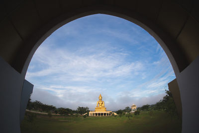 Low angle view of a building against cloudy sky