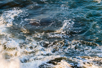 High angle view of water splashing in sea