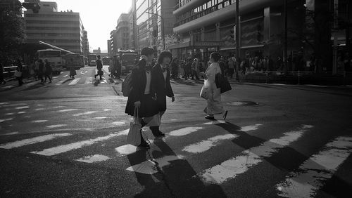 People walking on street in city