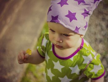 Close-up of cute girl standing outdoors