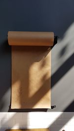 Blank brown paper hanging on wall