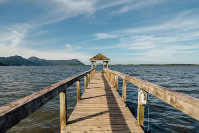 Pier over sea against sky