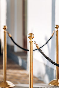 Close-up of rope tied on metal railing