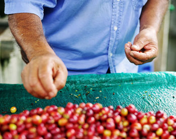 Midsection of man preparing food