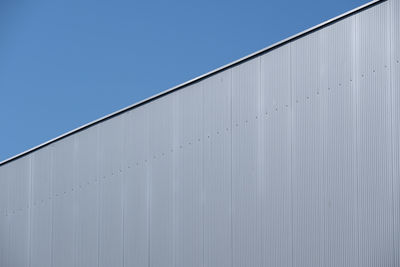 Low angle view of building against blue sky