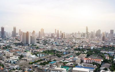 High angle view of modern buildings in city against sky