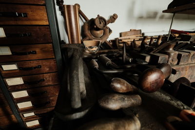 High angle view of hammer on wooden table