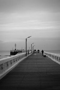 Pier over sea against sky