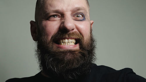 Portrait of man against gray background