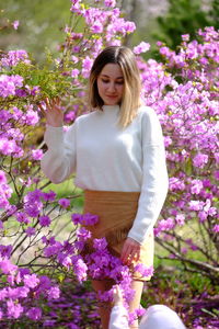 Rear view of woman with flowers