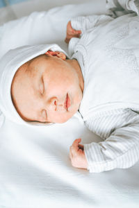 Cute baby sleeping on bed