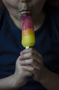 Midsection of man holding ice cream