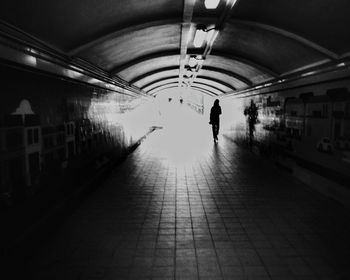 People walking in tunnel