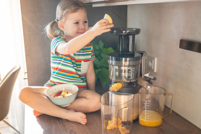 High angle view of boy preparing food on table