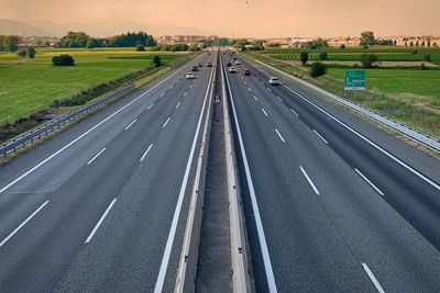 Motorway with flowing traffic seen from above.